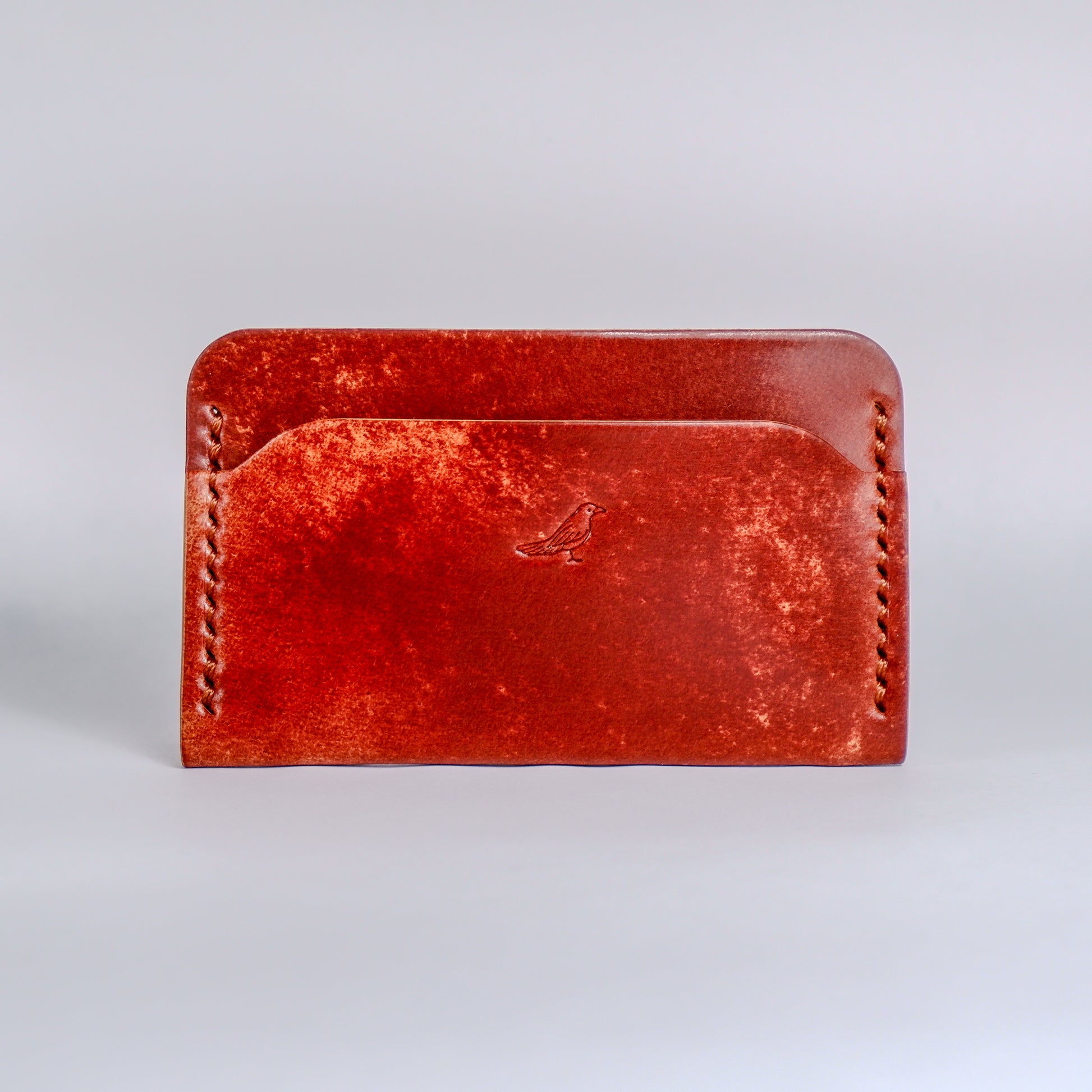 Closed Sienna (Light Brown) The Erikson-Marbled Shell Cordovan Wallet displayed on a white background.