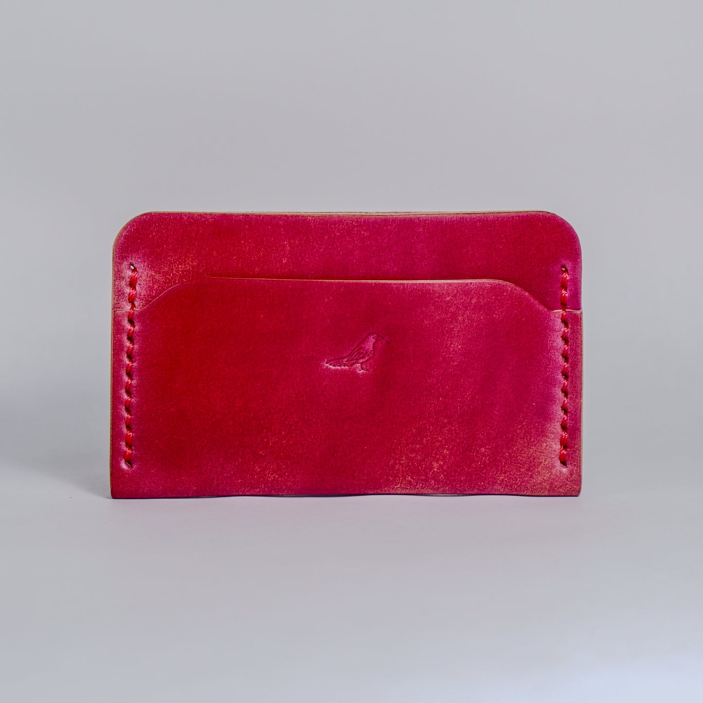 Closed Electric Pink The Erikson-Marbled Shell Cordovan Wallet displayed on a white background.