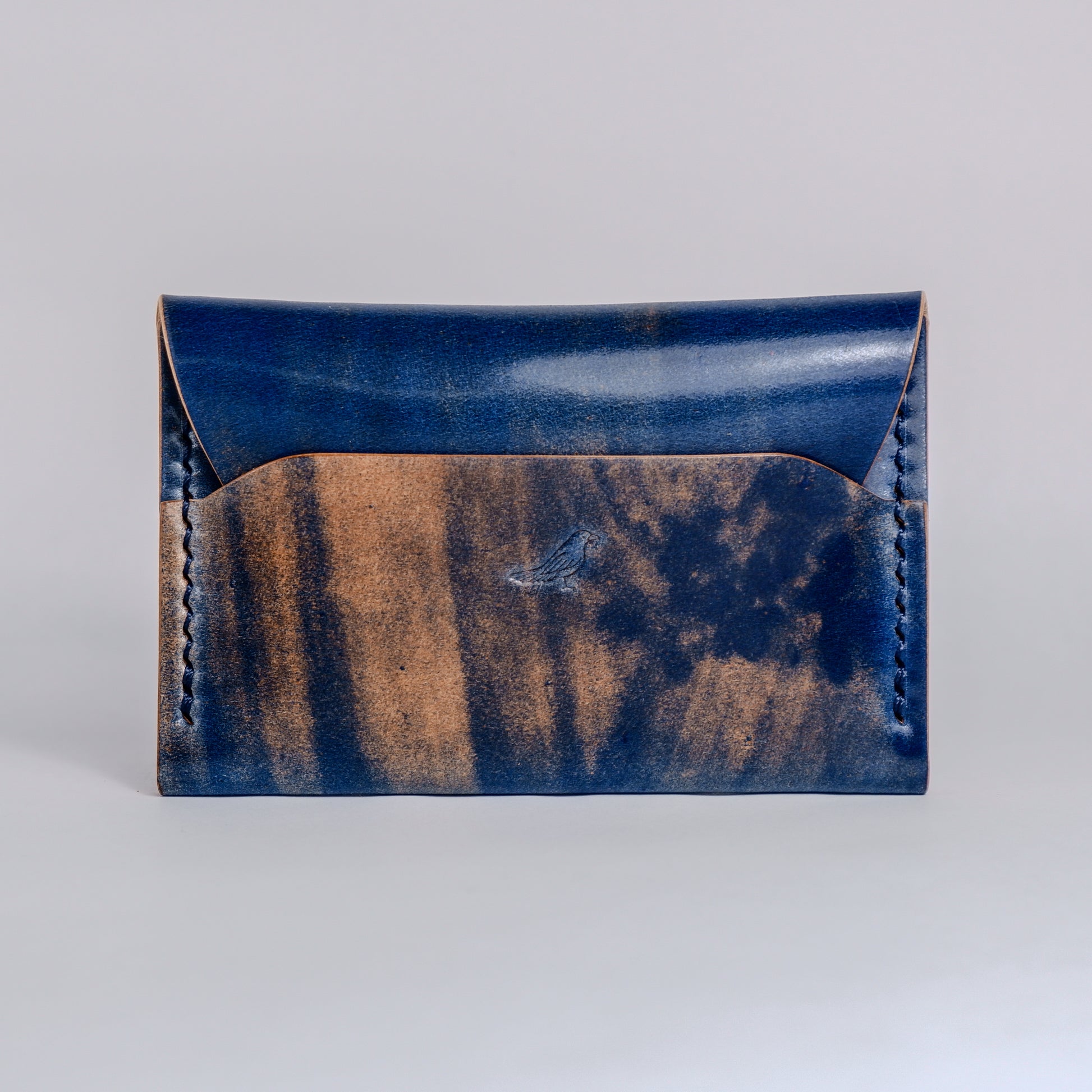 Closed Ocean (Blue) The Warden-Marbled Shell Cordovan Wallet displayed on a white background.