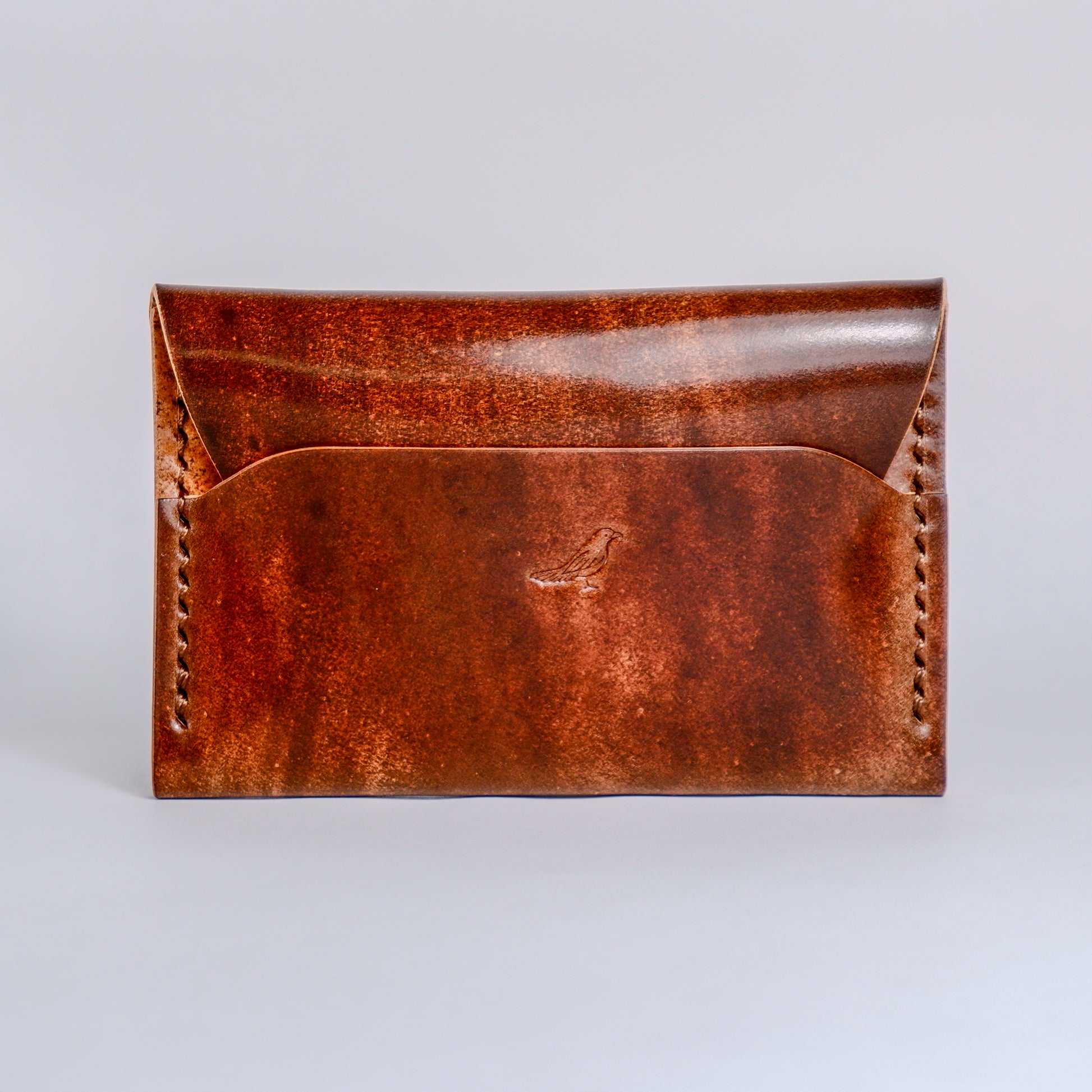 Closed Walnut (Dark Brown) The Warden-Marbled Shell Cordovan Wallet displayed on a white background.