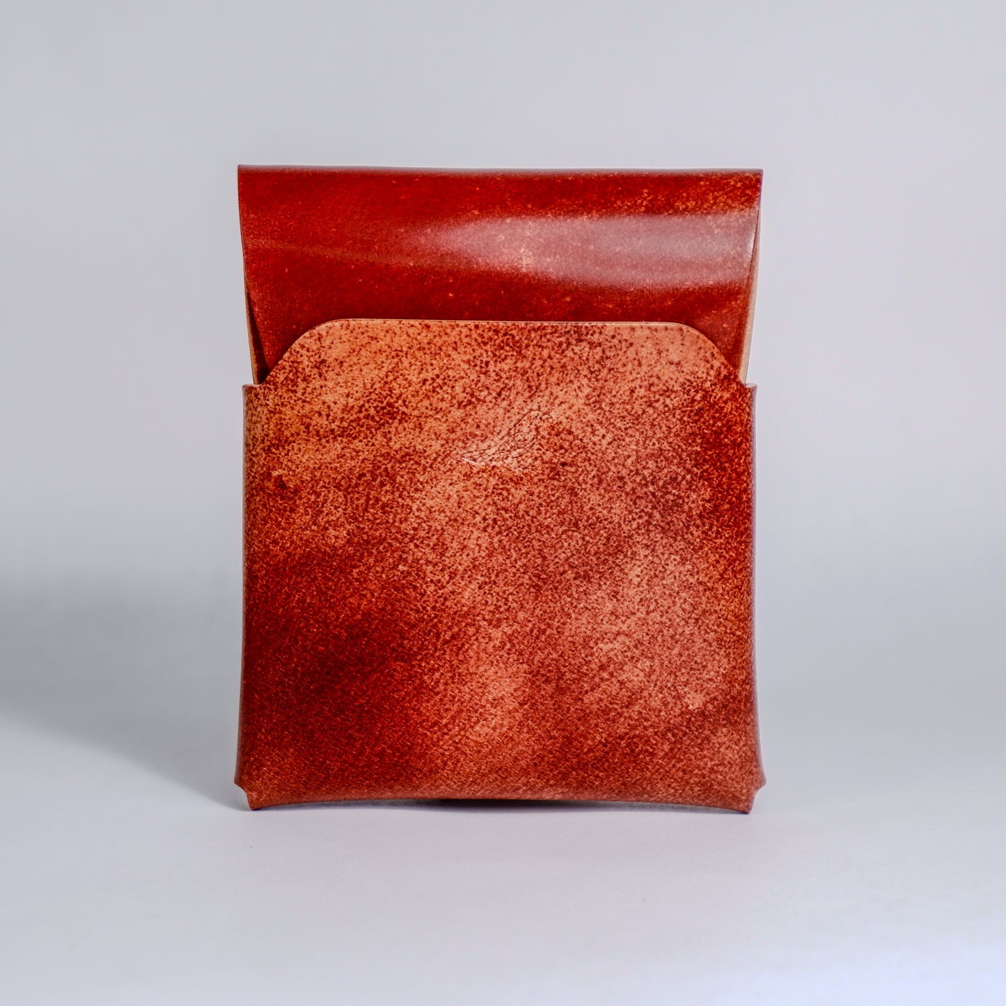 Closed Walnut (Dark Brown) The Cash Emerson-Marbled Shell Cordovan Wallet displayed on a white background viewed from the back