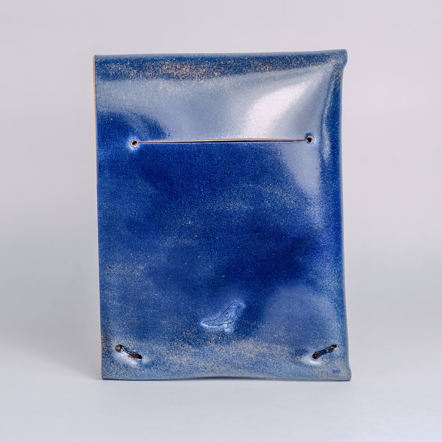 Closed Ocean (Blue) Archer-Marbled Shell Cordovan Wallet displayed on a white background viewed from the back