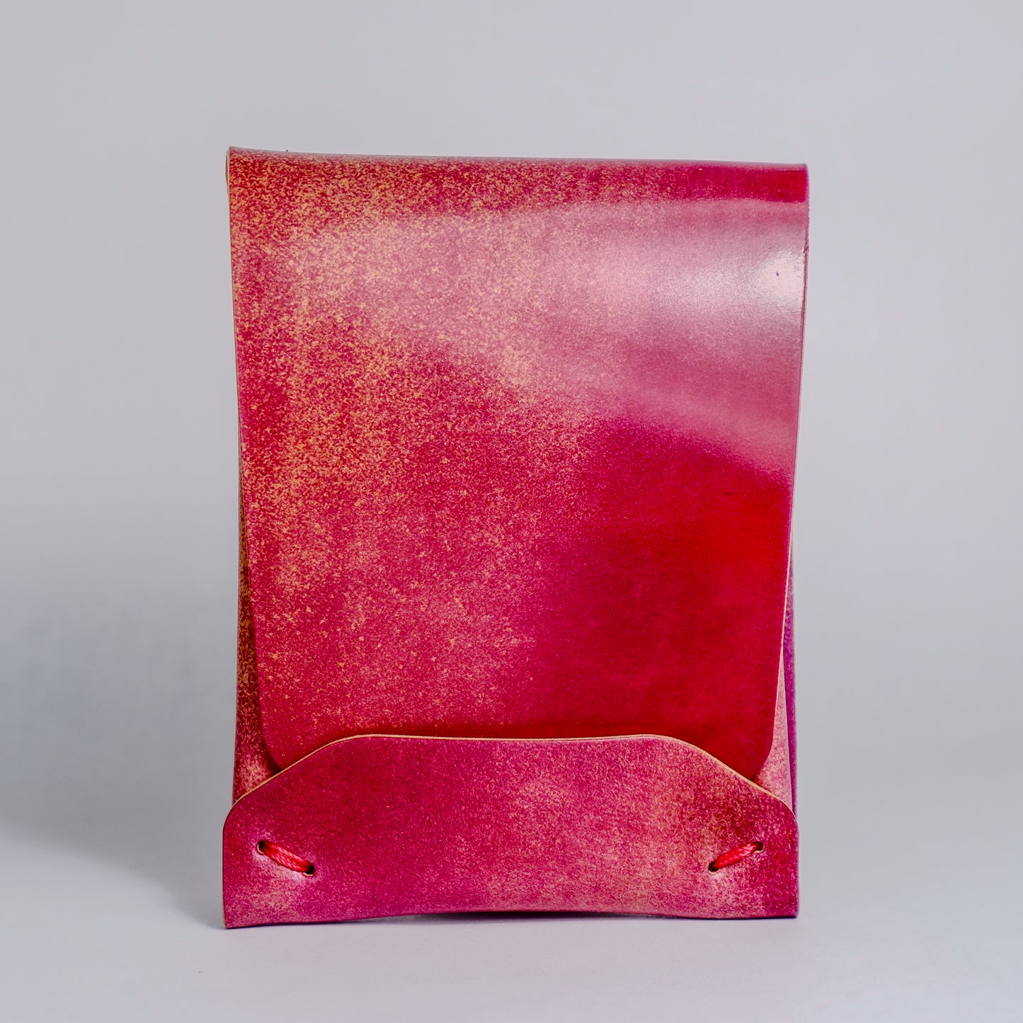 Closed Electric Pink Archer-Marbled Shell Cordovan Wallet displayed on a white background viewed from the front