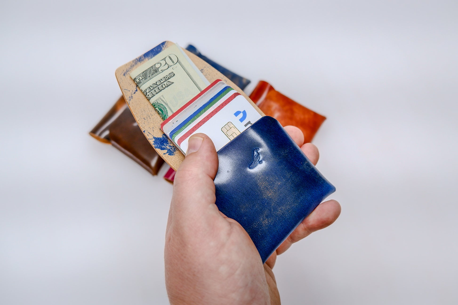 Opened Ocean (Blue) The Cash Emerson-Marbled Shell Cordovan Wallet displayed on a white background.