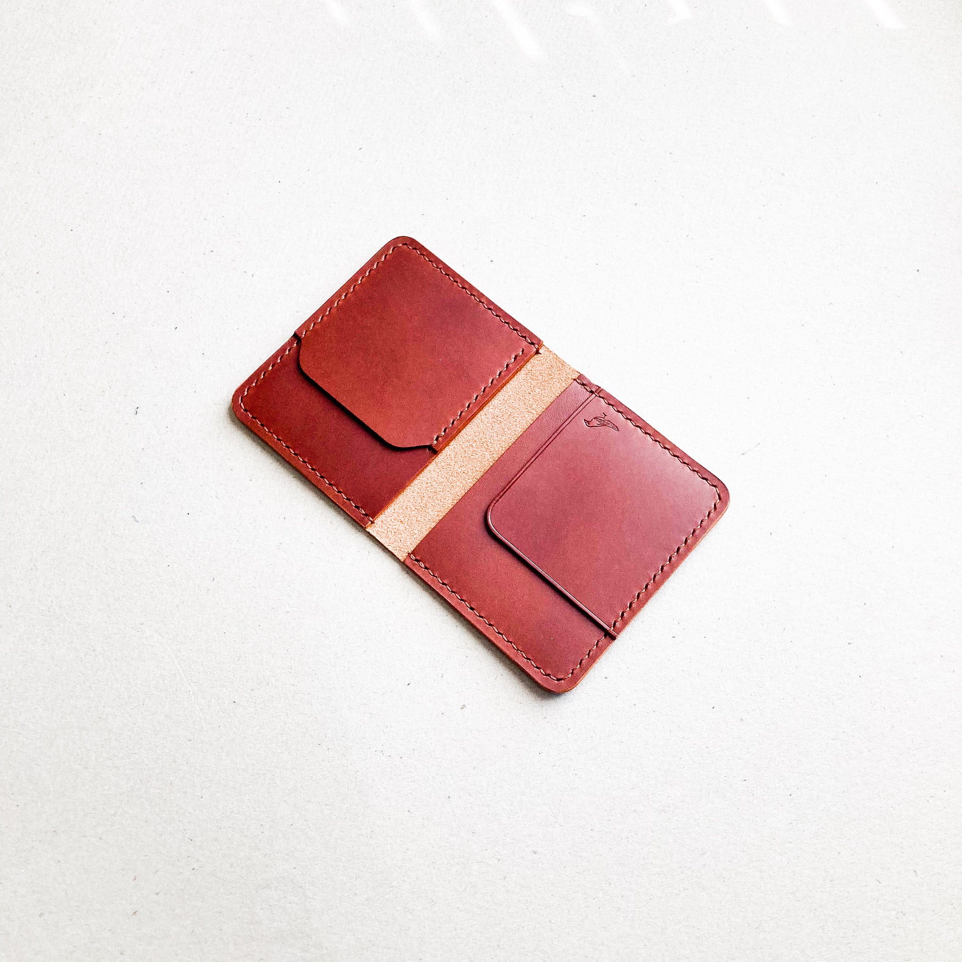 Opened Brown Pattern - Garrison Wallet displayed on a white table.