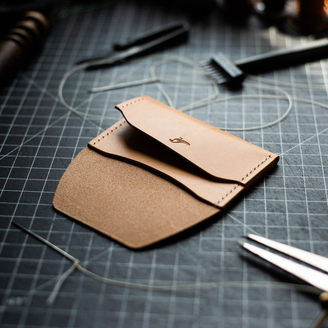 Opened Natural Pattern - Warden Wallet displayed on a workbench with tools nearly.