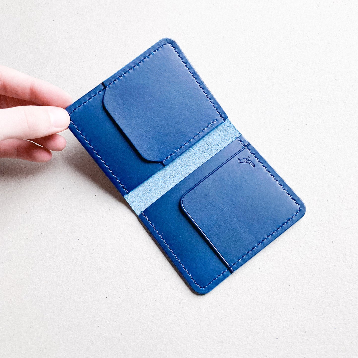 Blue Pattern - Opened Garrison Wallet displayed on a white table.