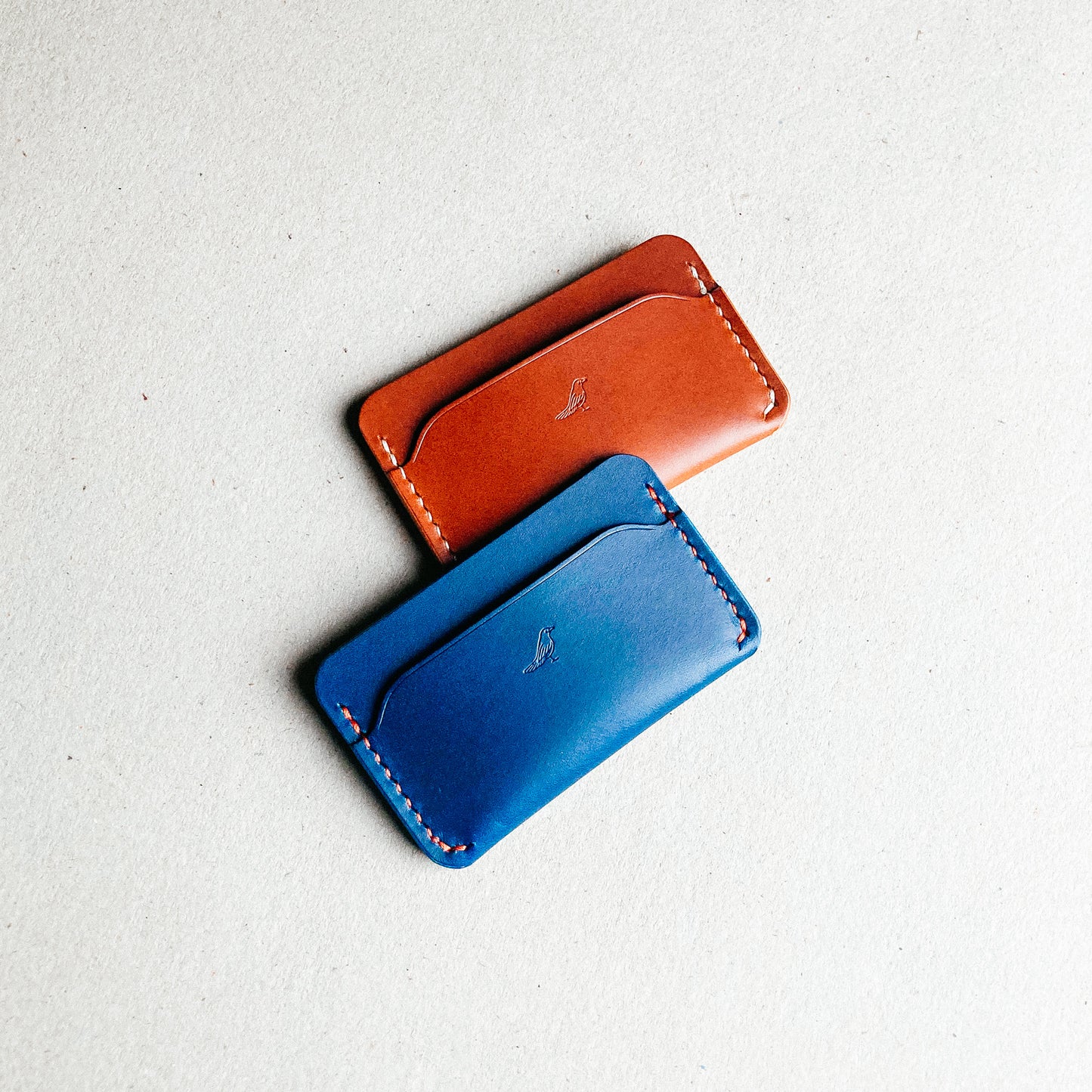 Blue and Brown Pattern - Erikson Wallets displayed side by side on a white table