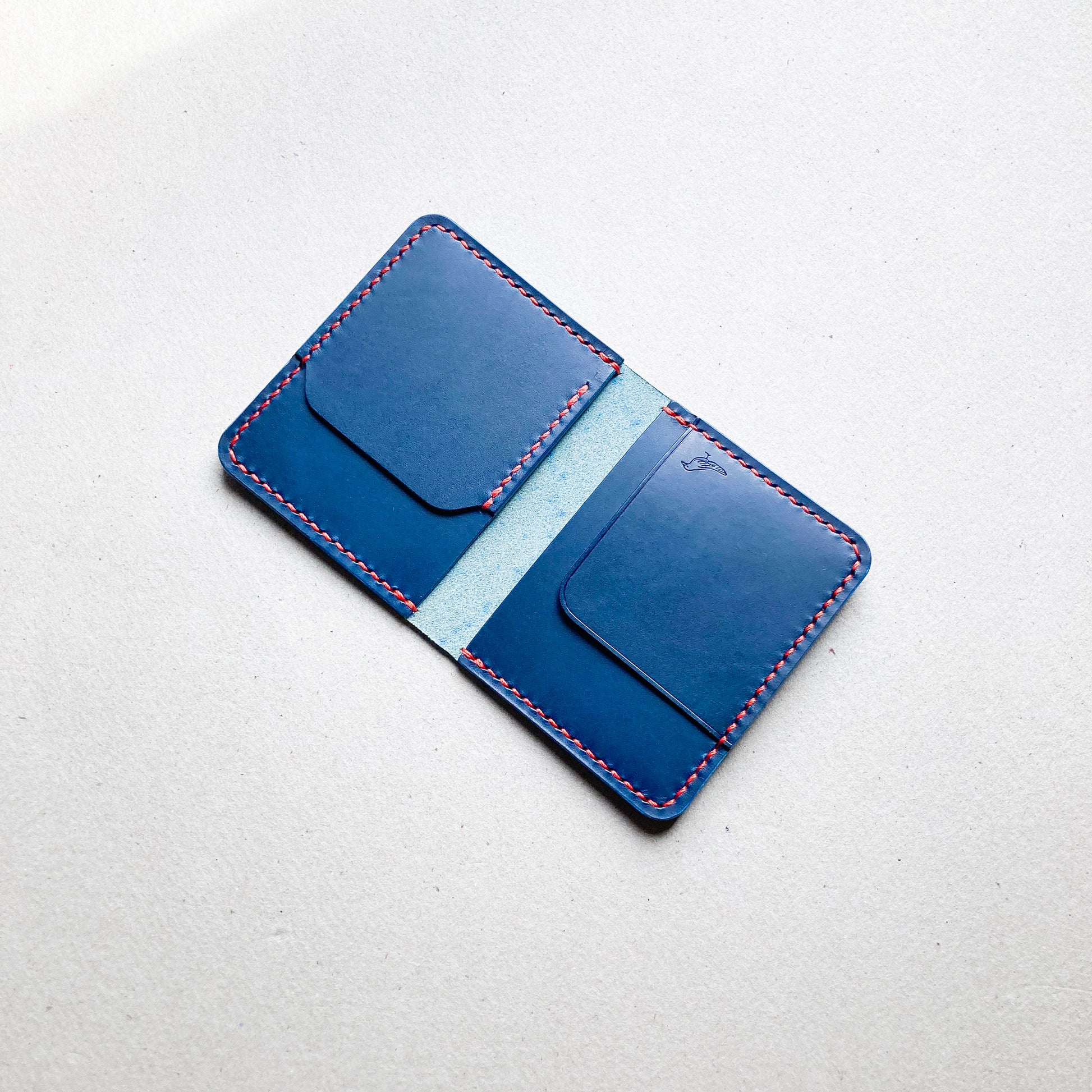 Blue Pattern - Opened Garrison Wallet displayed on a white table.