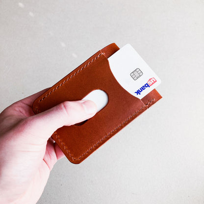 Opened Brown Pattern - Kingston Wallet held by a man against a brown blurred background.